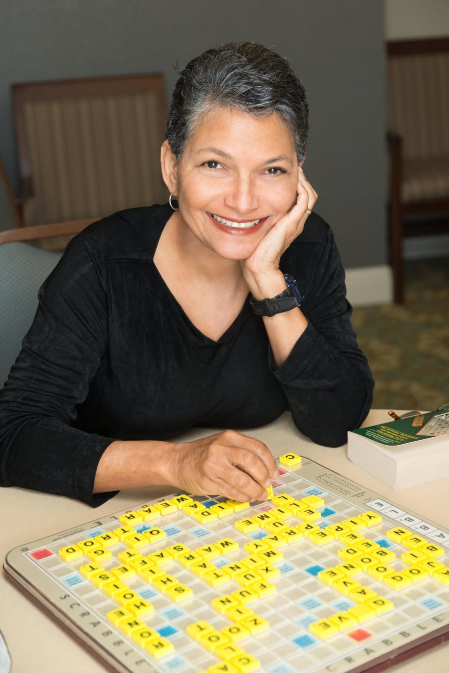 Melanie Payne at a Scrabble board
